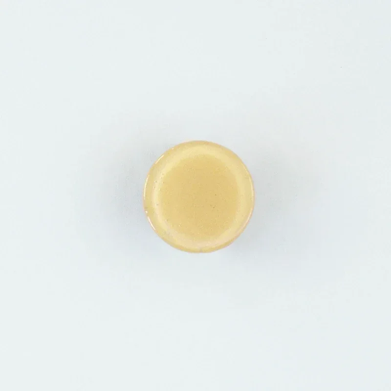 Rund möbelknopp i glas Kräm
