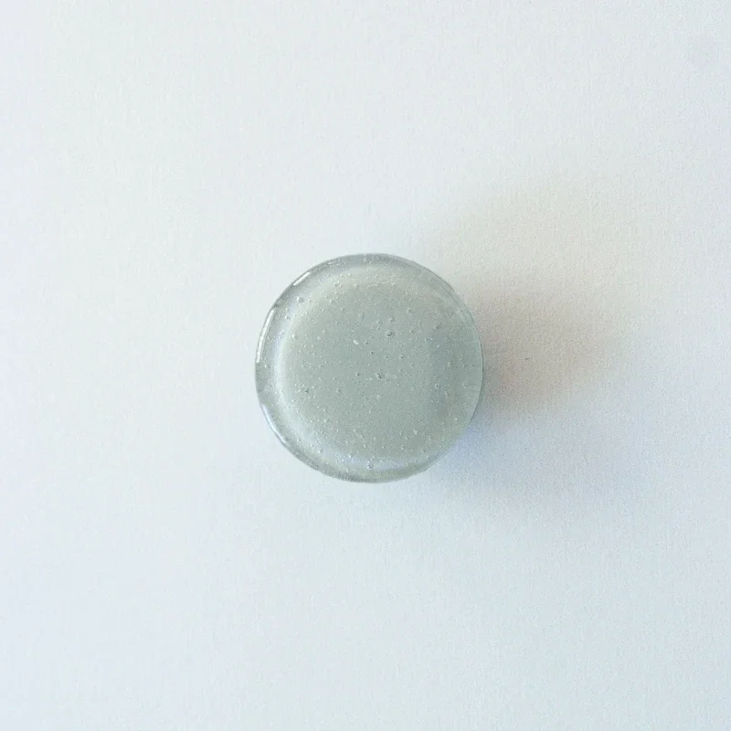 Möbelknopp, rund, glas, grå